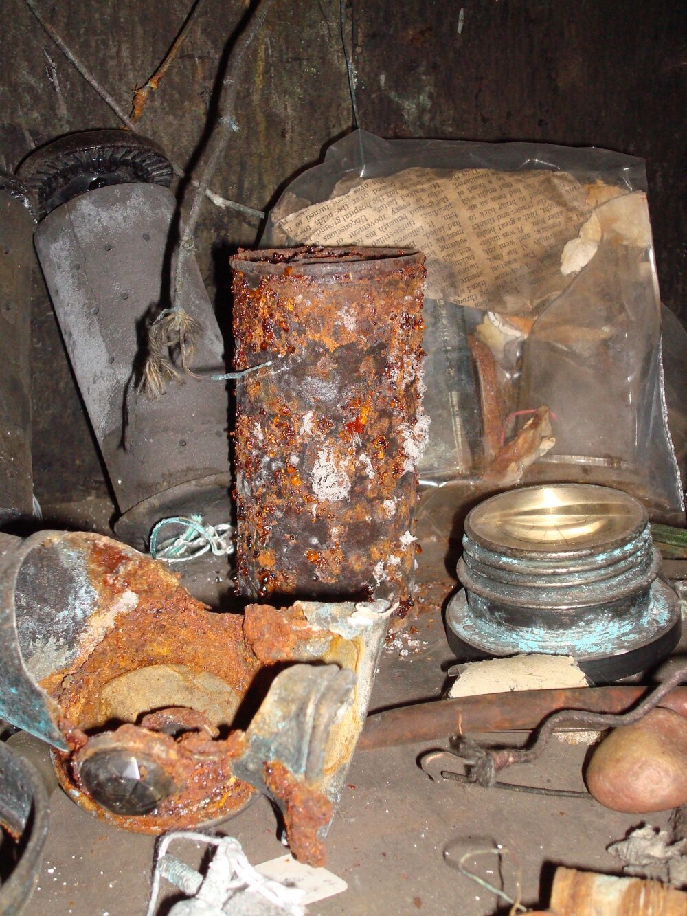 Corroded and rusted artefacts on radio table,  Scott's 'Terra Nova' Hut 