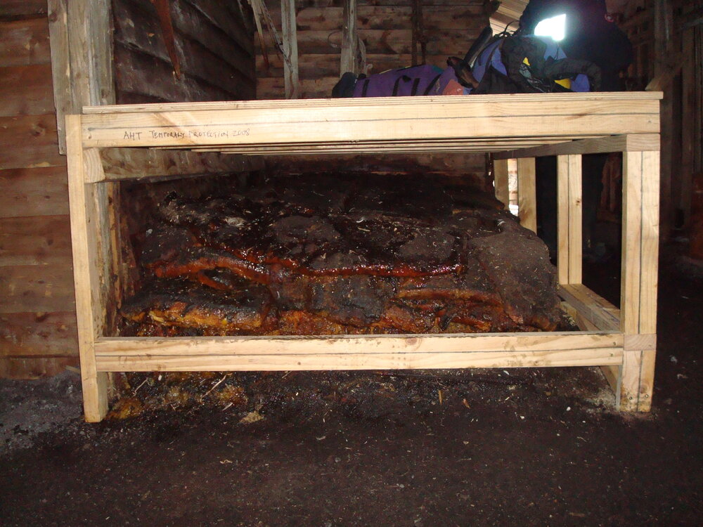 Temporary protection frame built for blubber stack, Scott's 'Terra Nova' Hut