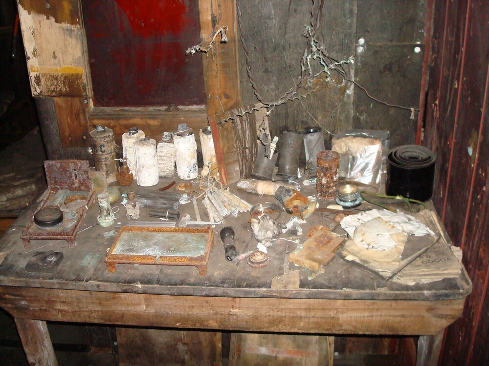 Artefacts on 'Make and Mend' bench, Scott's 'Terra Nova' Hut (001)