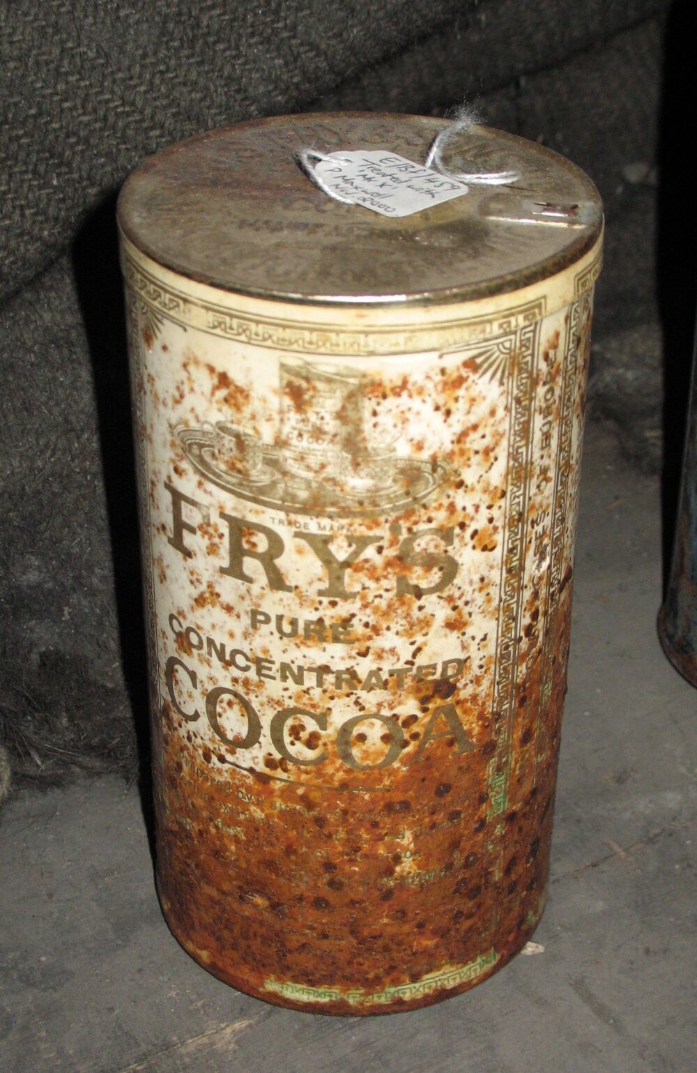 Corroded tin of 'Fry's' Cocoa with coating applied, Scott's 'Discovery' Hut
