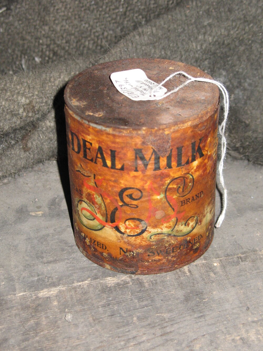 Corroded tin of 'Ideal' milk with coating applied, Scott's 'Discovery' Hut