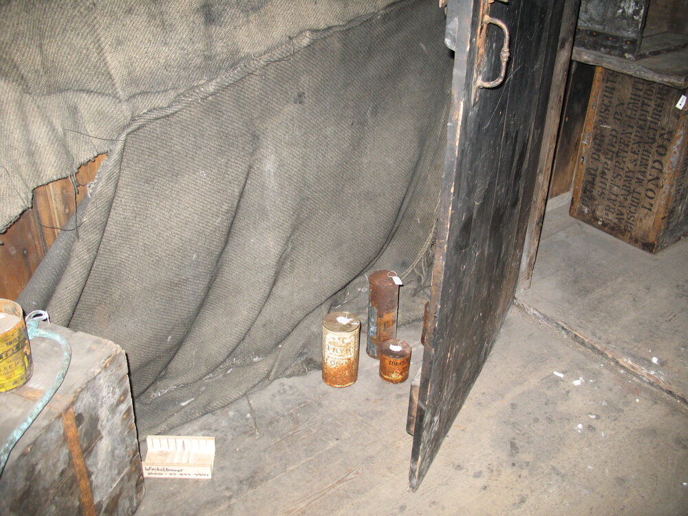 Corroded tins of food with coating applied, Scott's 'Discovery' Hut (001)
