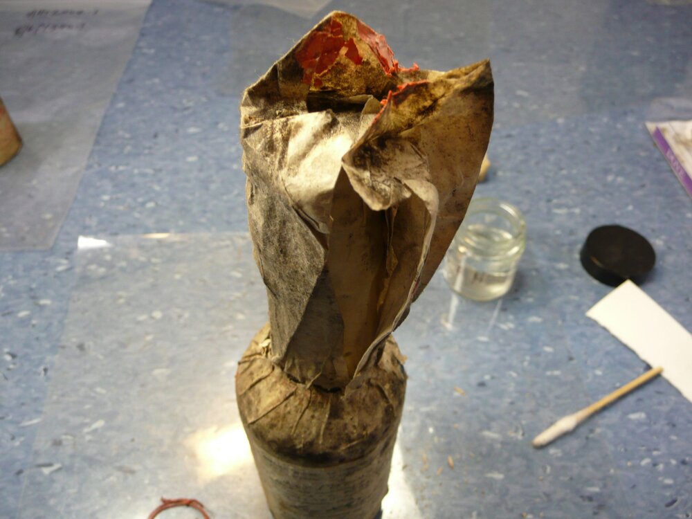 Unfolding wrapper on bottle (001)