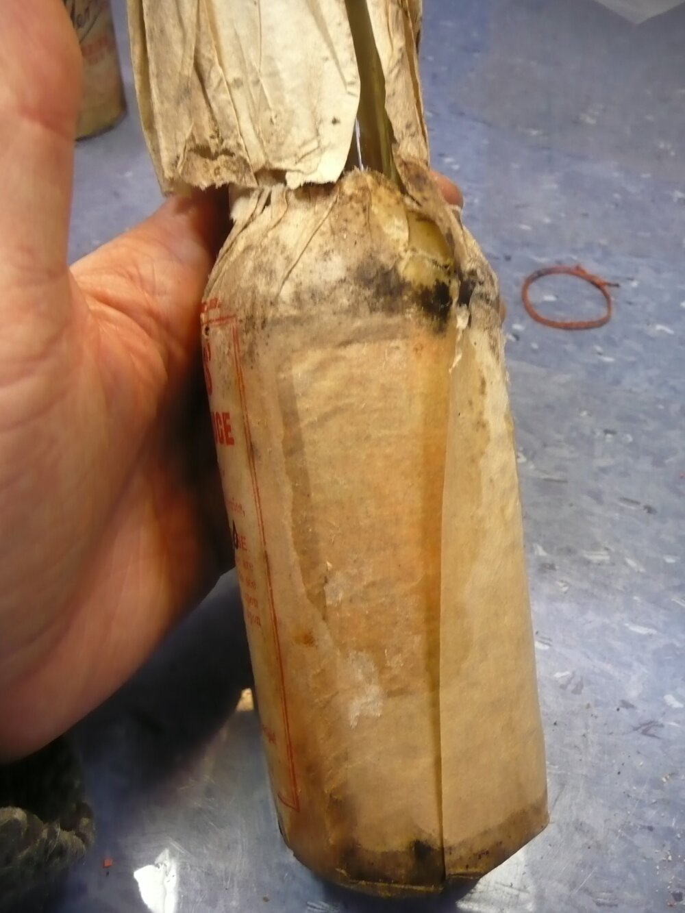 Unfolding wrapper on bottle (002)