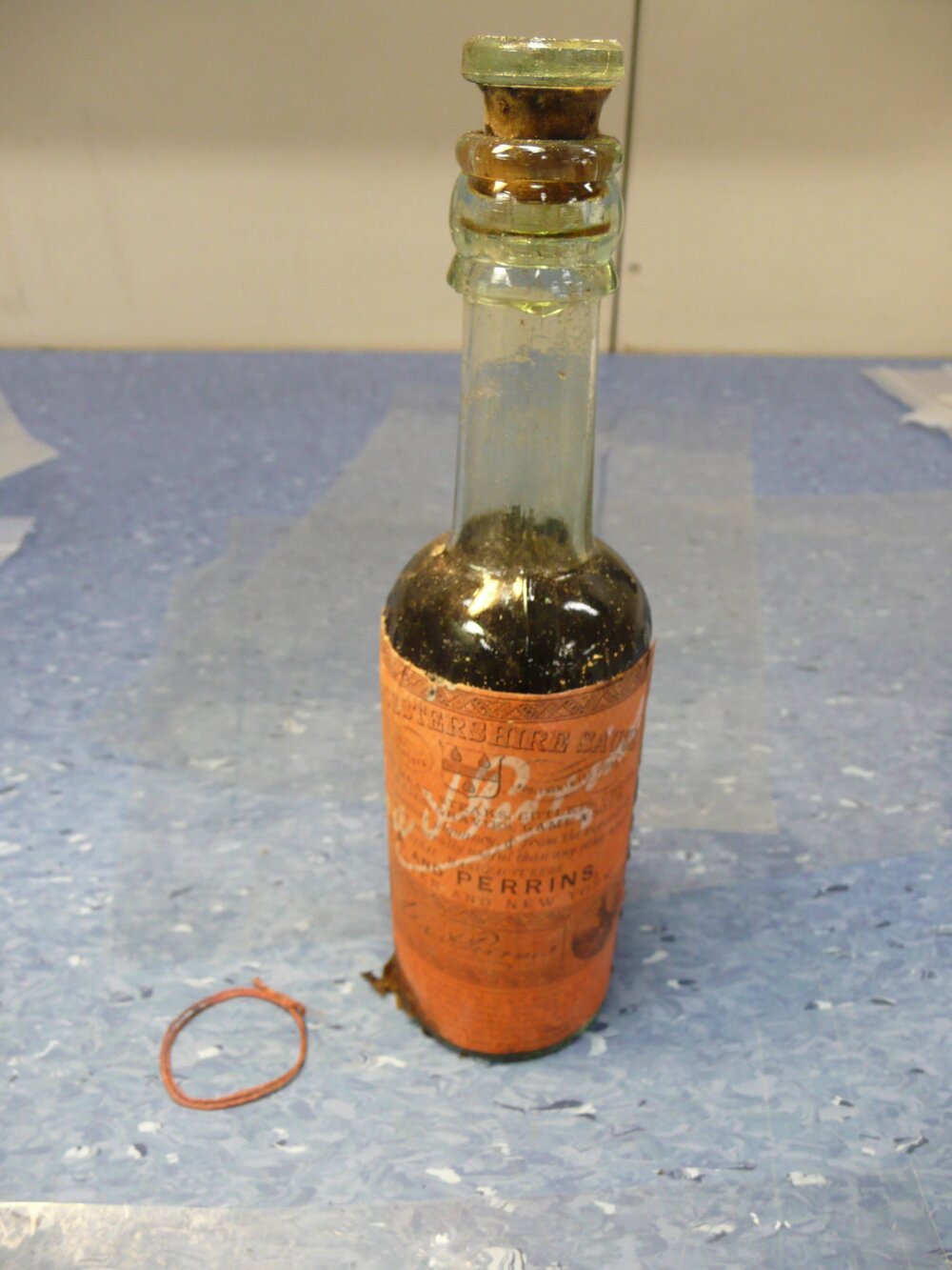 Unfolding wrapper on bottle (004)