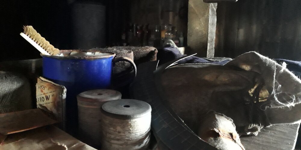 2017-18 Scott's 'Terra Nova' hut, interior, artefacts on Wright's bunk