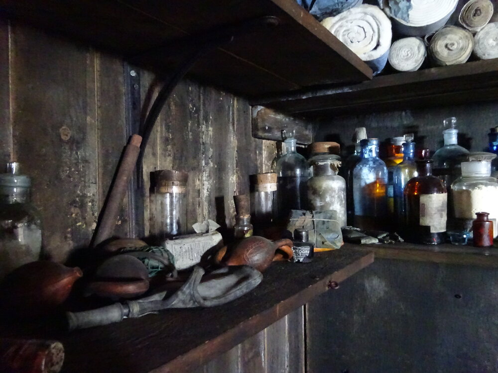 2017-18 Scott's 'Terra Nova' hut, interior, medicines on shelving