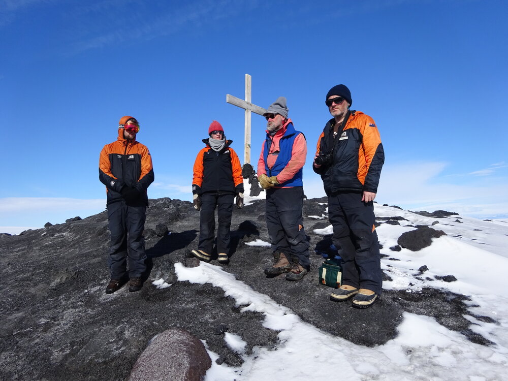 2017-18 Antarctic Heritage Trust conservation team at Wind Vane Hill cross