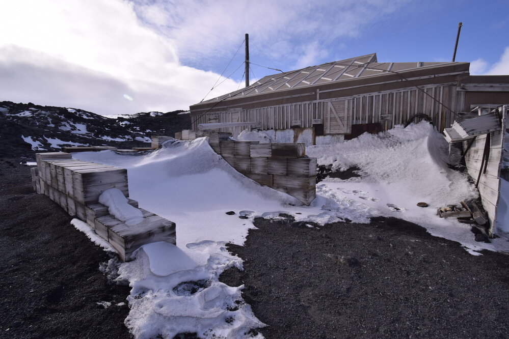 2017-18 Shackleton's 'Nimrod' hut, exterior, snow build-up in Garage and Stables