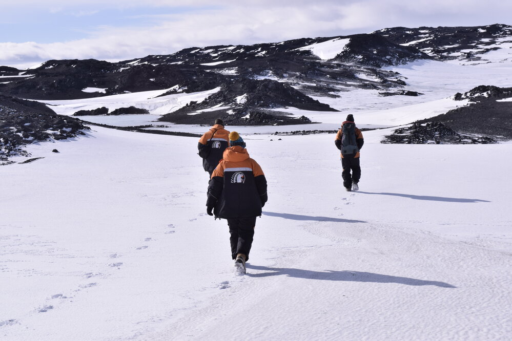 2017-18 Antarctic Heritage Trust conservation team members on a hike
