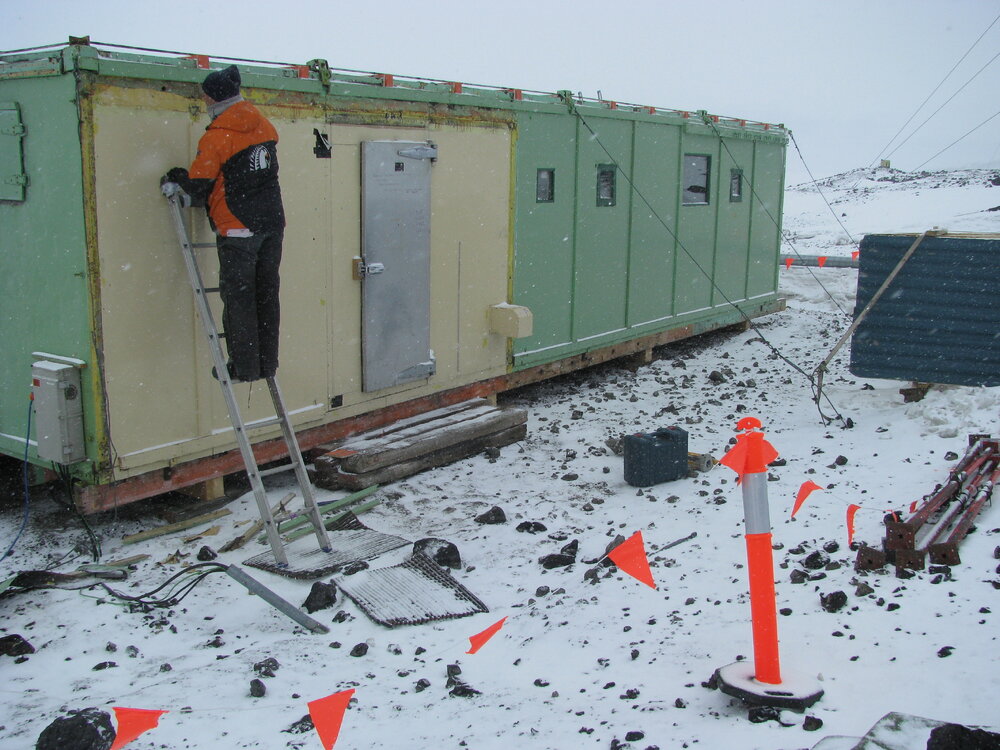 2016-17 AHT's Doug Henderson working on the exterior of Hillary's TAE/IGY hut, Scott Base