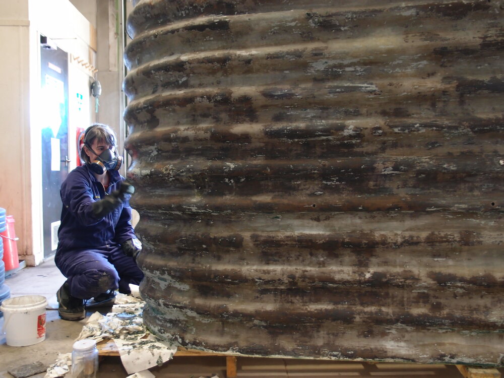 2016-17 AHT's Lizzie Meek stripping paint from Covered Walkway