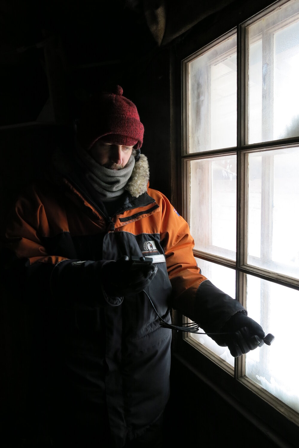 2013-14 Josiah Wagener taking readings inside Scott's 'Discovery' hut, Hut Point