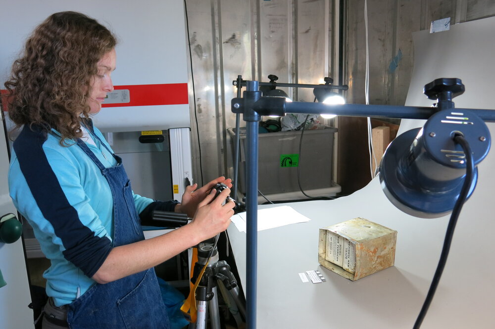 2013-14 Elana Hawke photographing artefacts, Scott Base