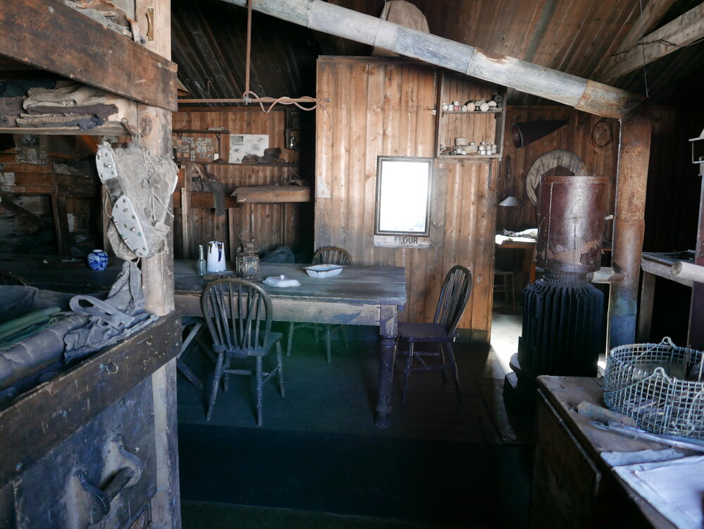 2018-19 Wardroom table inside Scott's 'Terra Nova' hut, Cape Evans