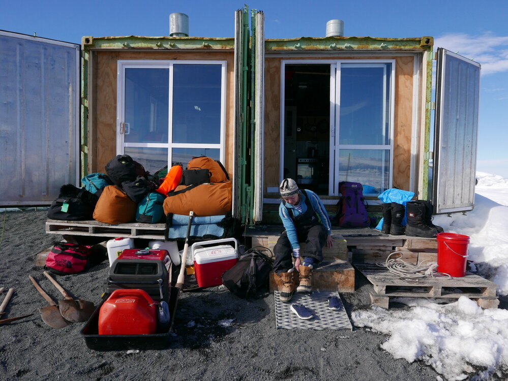 2018-19 Nicola Stewart outside the field camp container, Cape Evans