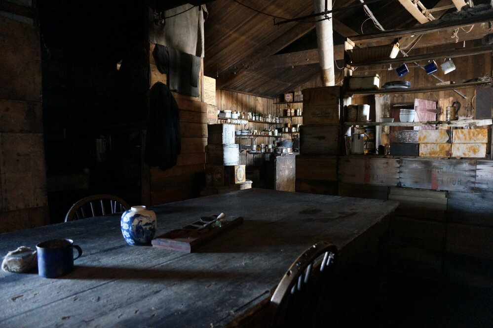 2018-19 Wardroom table inside Scott's 'Terra Nova' hut, Cape Evans