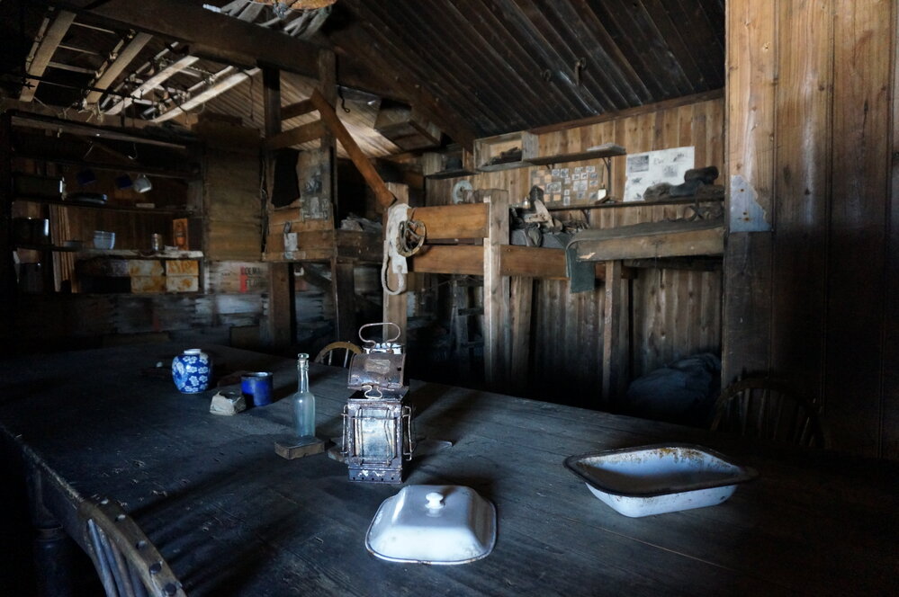 2018-19 Wardroom table inside Scott's 'Terra Nova' hut, Cape Evans