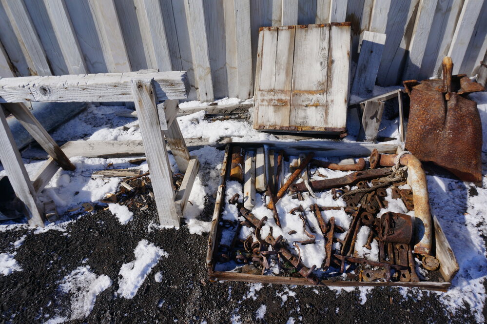 2018-19 Artefacts outside the West wall of Scott's 'Terra Nova' hut, Cape Evans