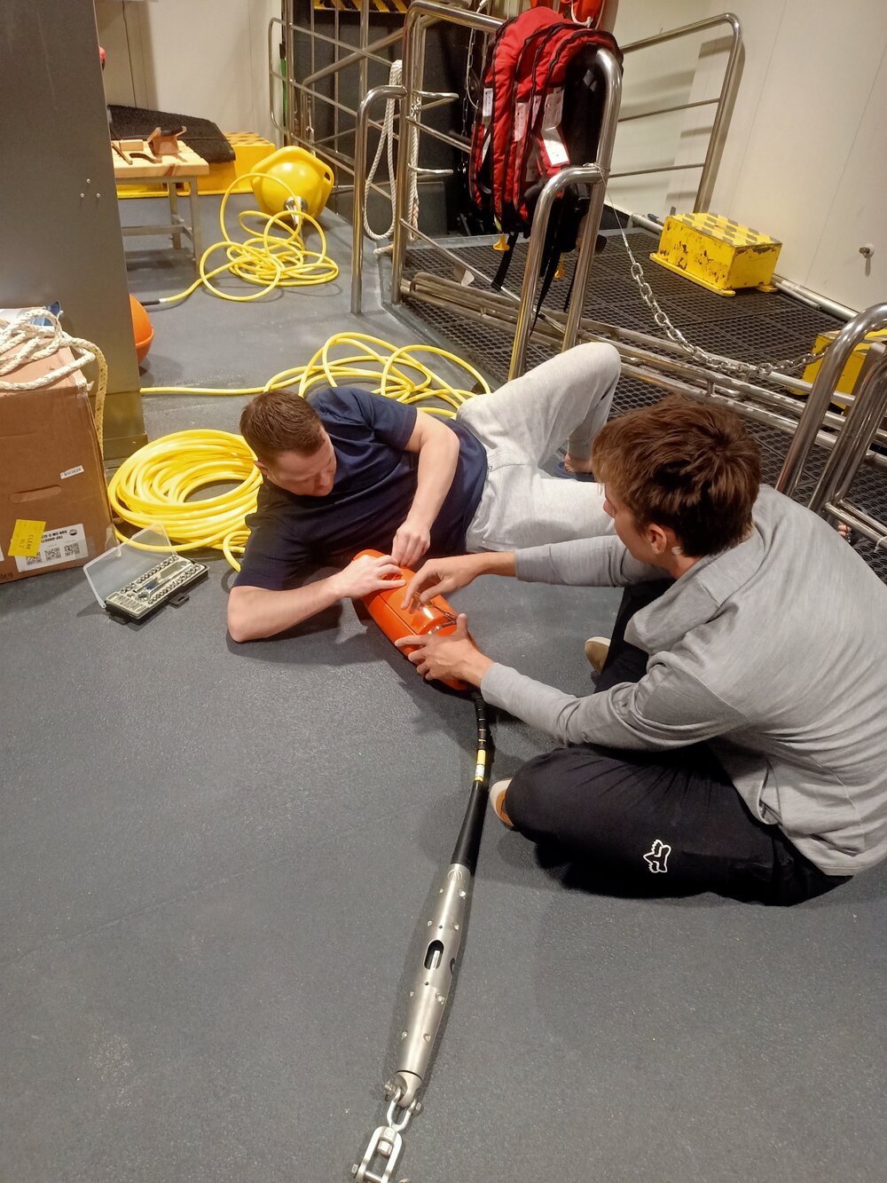 Lawrence Rothwell and Henry Conquer with MetService spotter buoy