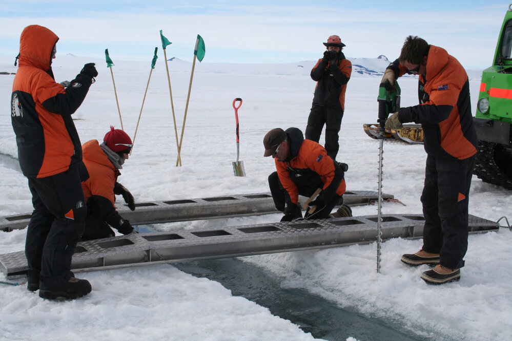 2013-14 Preparing a route over a crack in the sea-ice for the H&auml;gglunds (001)
