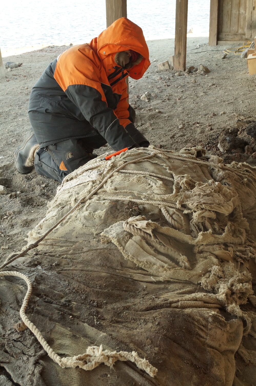 2013-14 Josiah Wagener with awning outside Scott's 'Discovery' hut, Hut Point