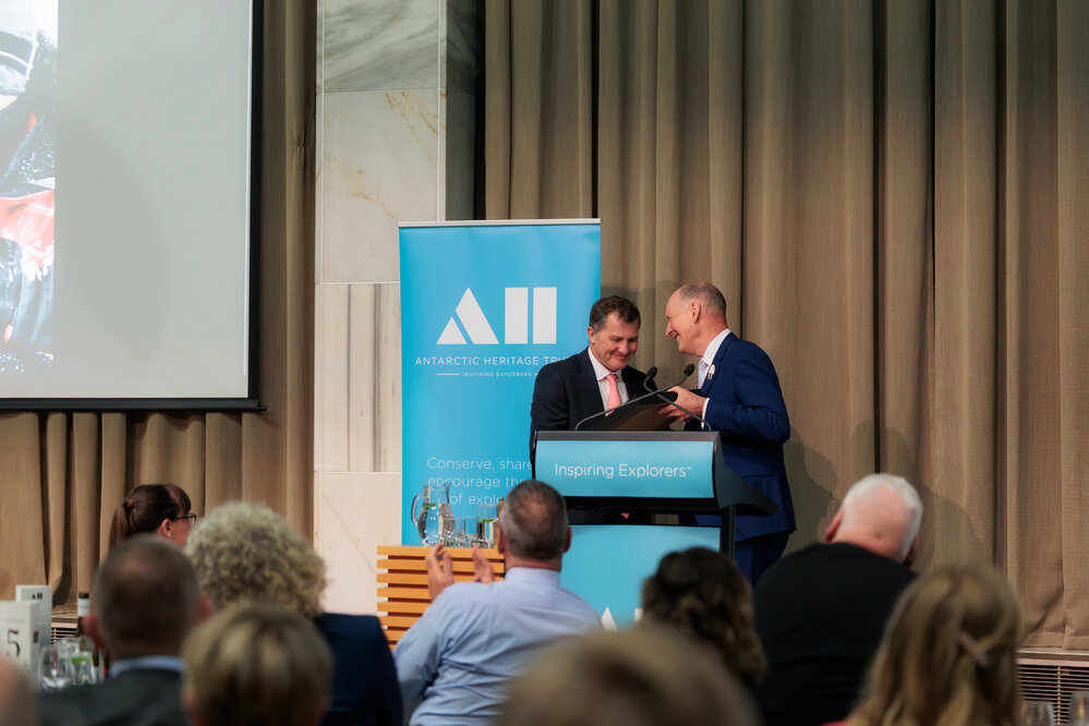 Nigel Watson accepting gift