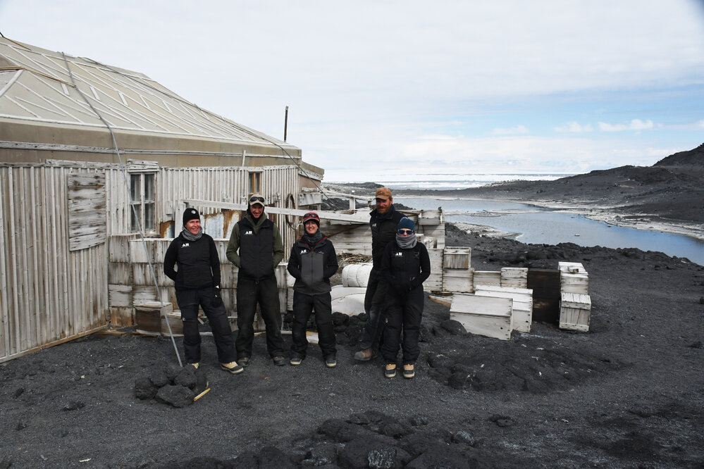 2022-23 Conservation team outside Shackleton's 'Nimrod' hut, Cape Royds