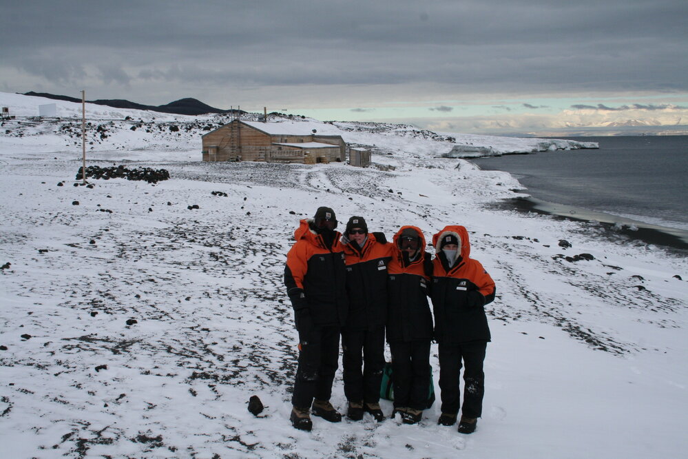 2014 AHT winter conservation team in front of Scott's 'Terra Nova' hut, Cape Evans