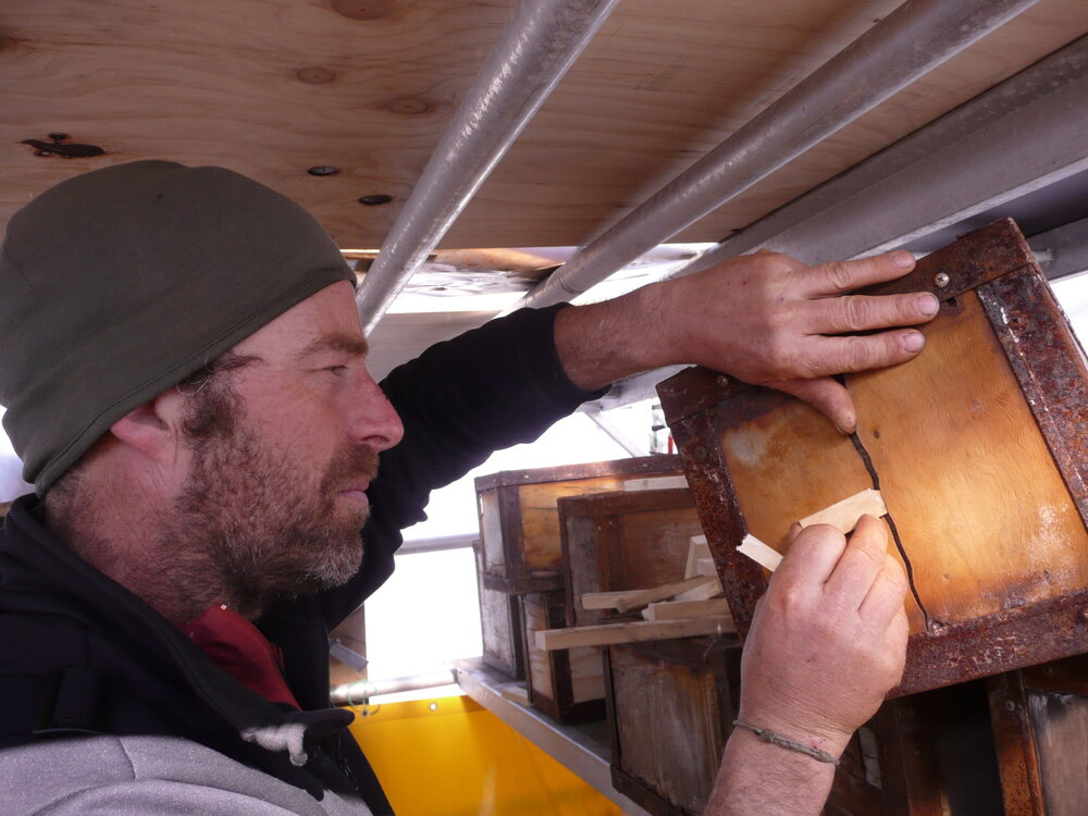 2010-11 Jaime Ward repairing a Venesta case, Cape Royds