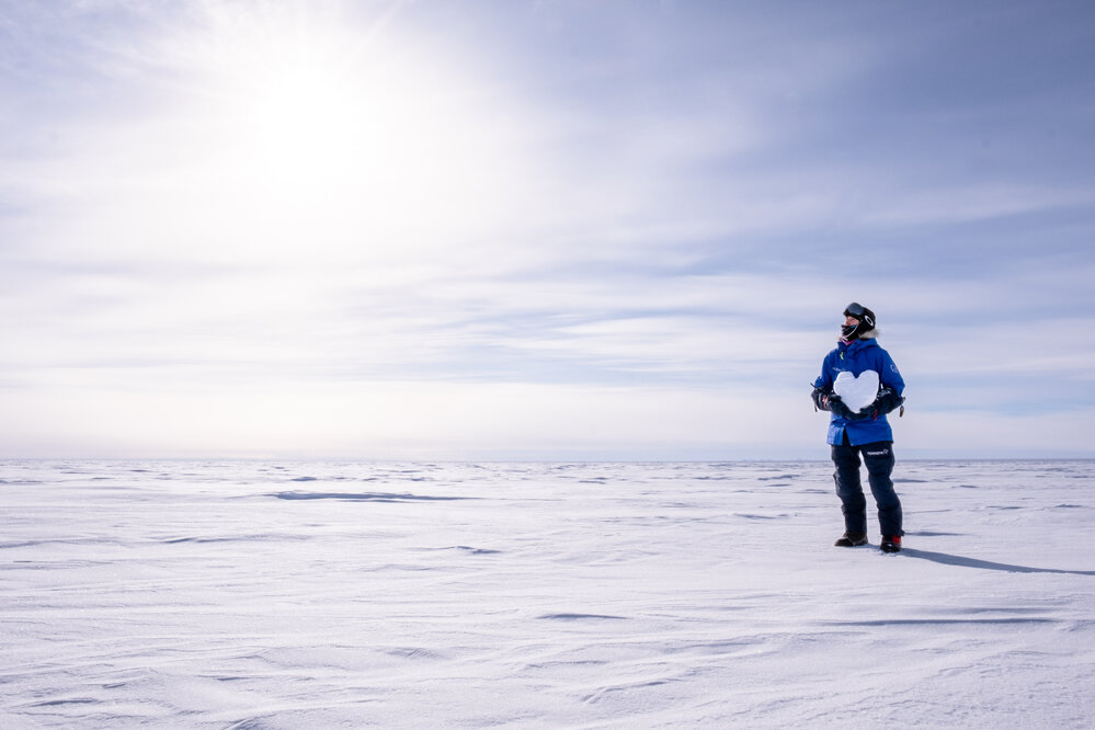 Marthe Brendefur with an ice heart on the South Pole Expedition