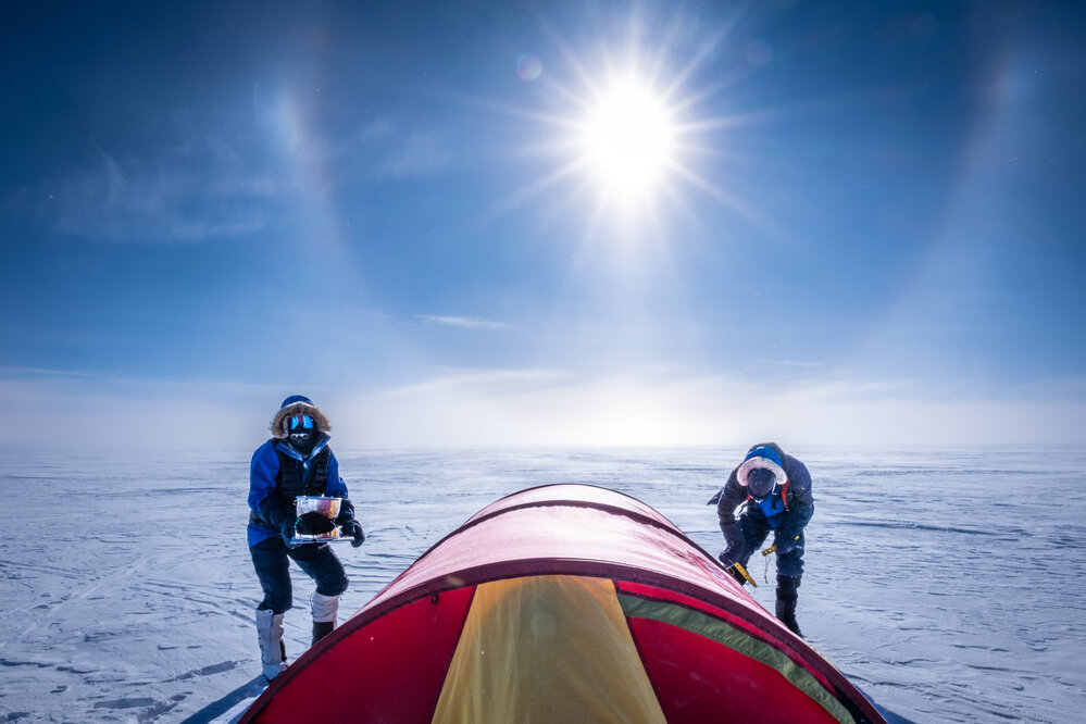 Laura Andrews and Mike Dawson pitching a tent on the South Pole Expedition