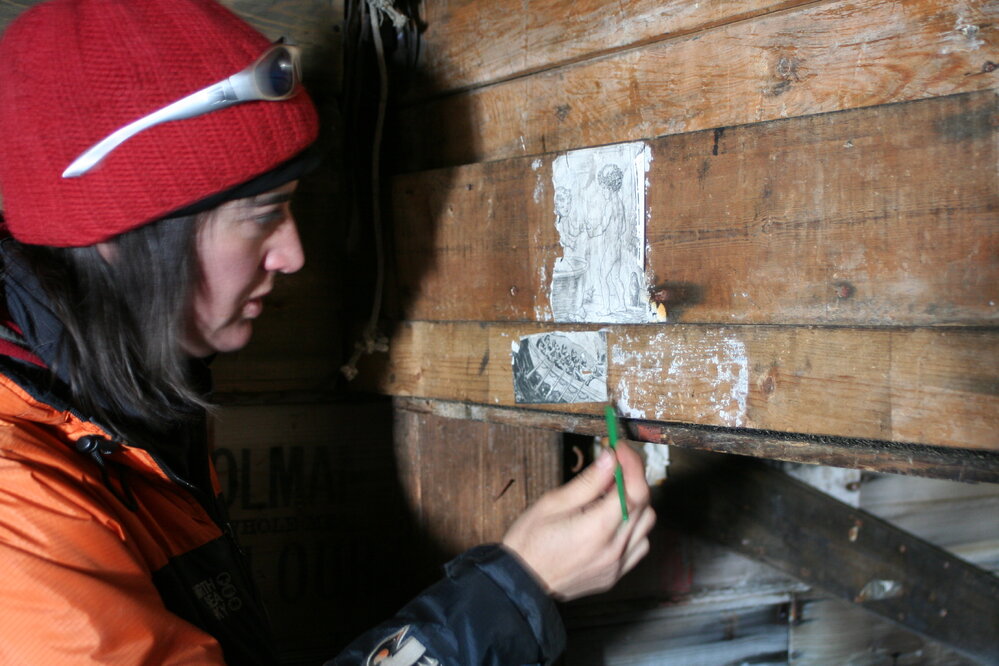 Lizzie Meek conserving insitu paper on wall
