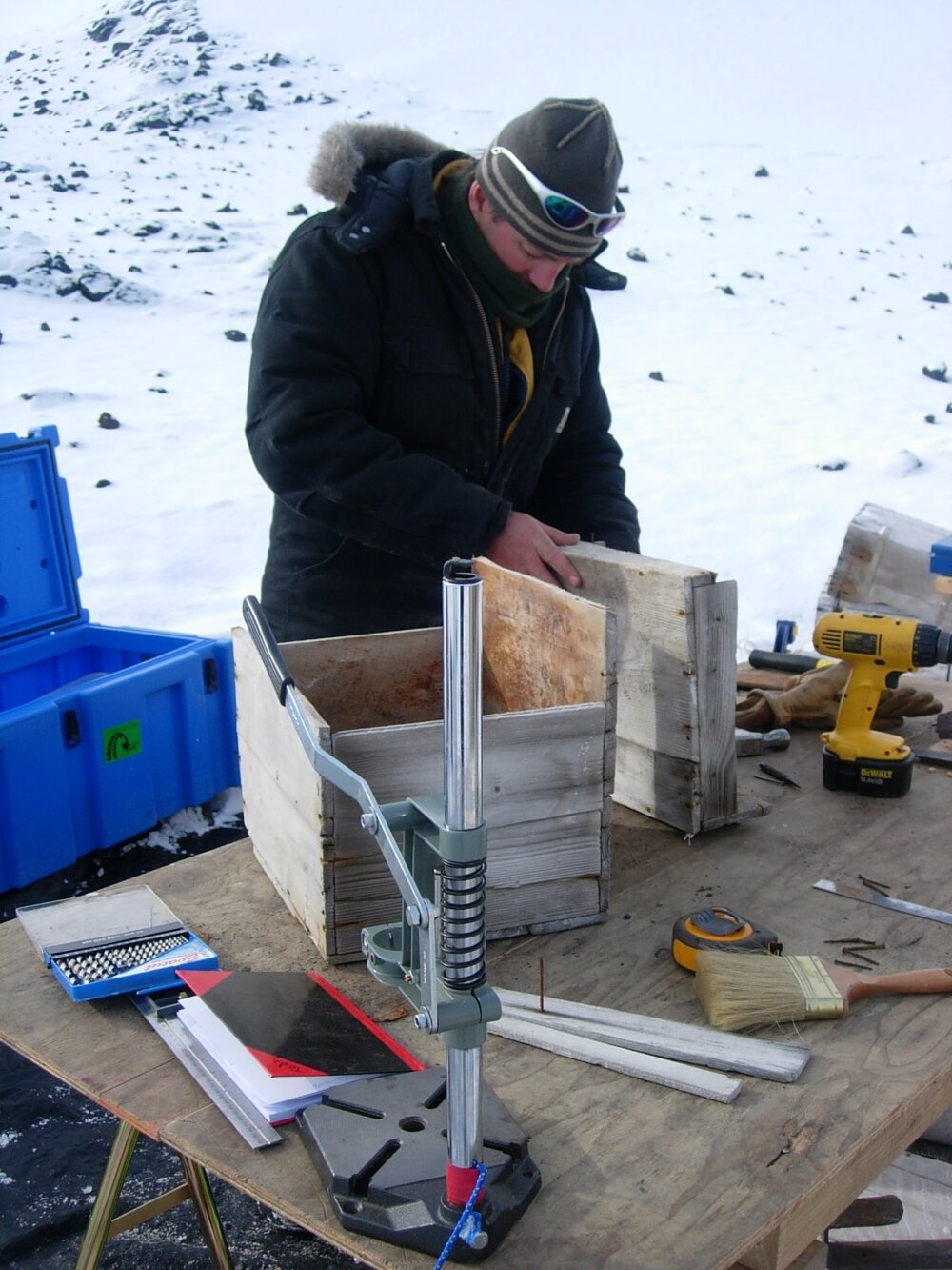 Heritage Carpenter Bryce Lewis repairing boxes from stables wall