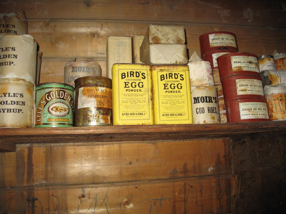 Tinned food on shelf in Shackleton's 'Nimrod' hut