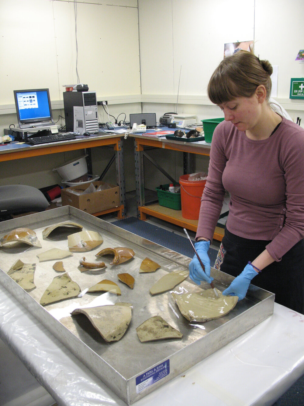 AHT Conservator Carla Pike washing ceramics