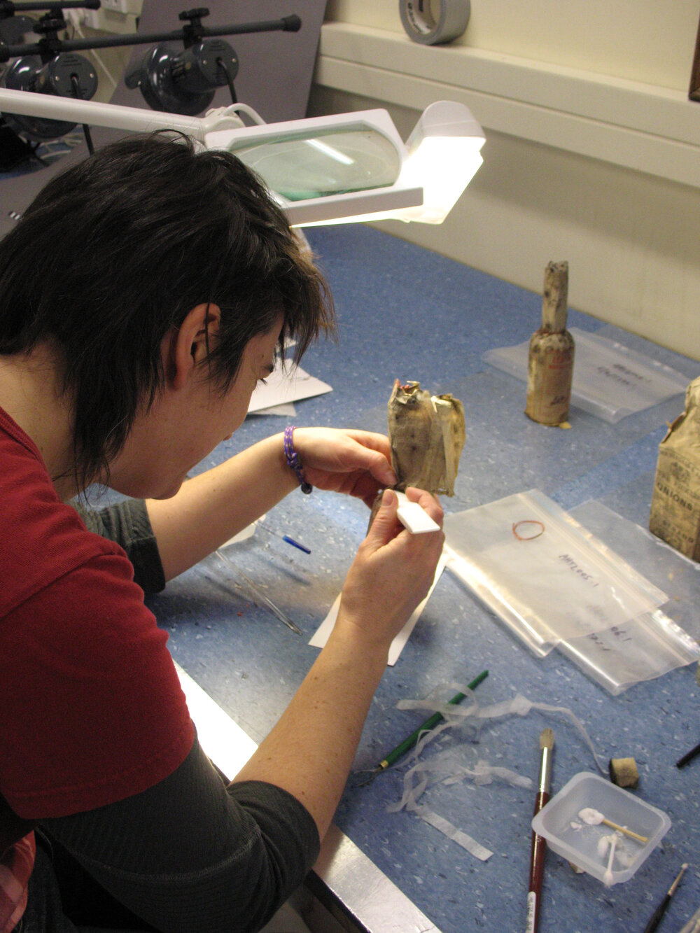 AHT Conservator Lizzie Meek treating a bottle of Savoy Sauce (001)
