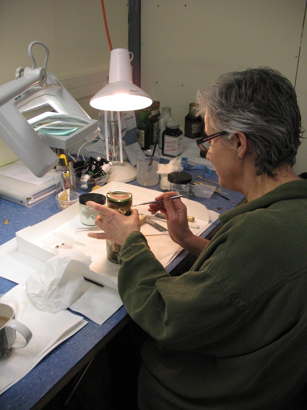 AHT Conservator Therese Charbonneau treating a bottle of pickles