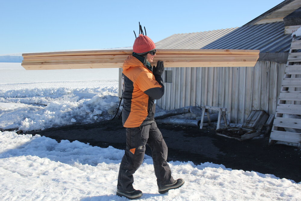 2018-19 Lizzie Meek carrying wood supplies, Cape Evans (002)