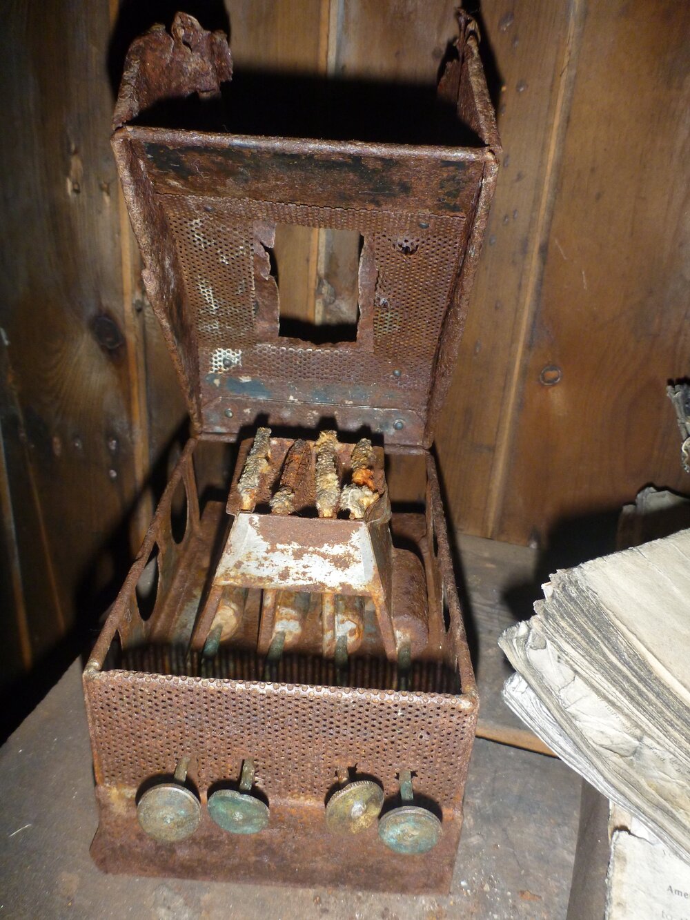 Portable fuel camp stove and magazines in Scott's 'Terra Nova' hut (001)