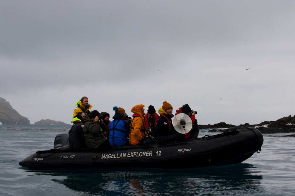 Inspiring Explorers and passengers in a zodiac, Elsehul Bay