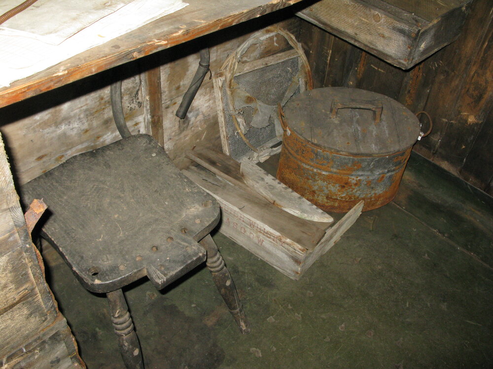 2010-11 Artefacts underneath the Biology desk inside Scott's 'Terra Nova' hut