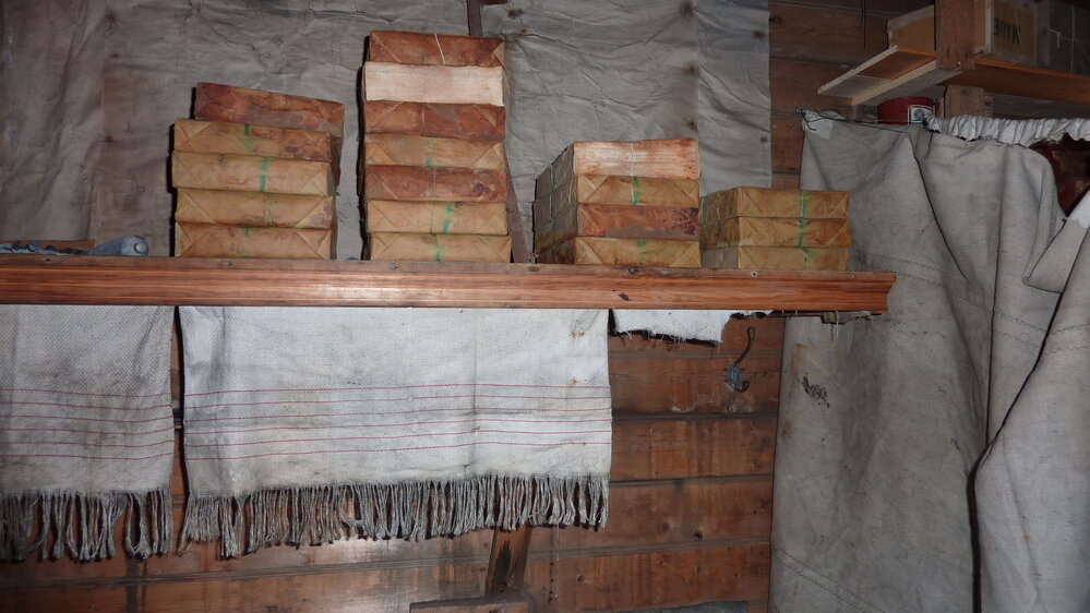 2010-11 Reams of paper stacked on shelves inside Shackleton's 'Nimrod' hut