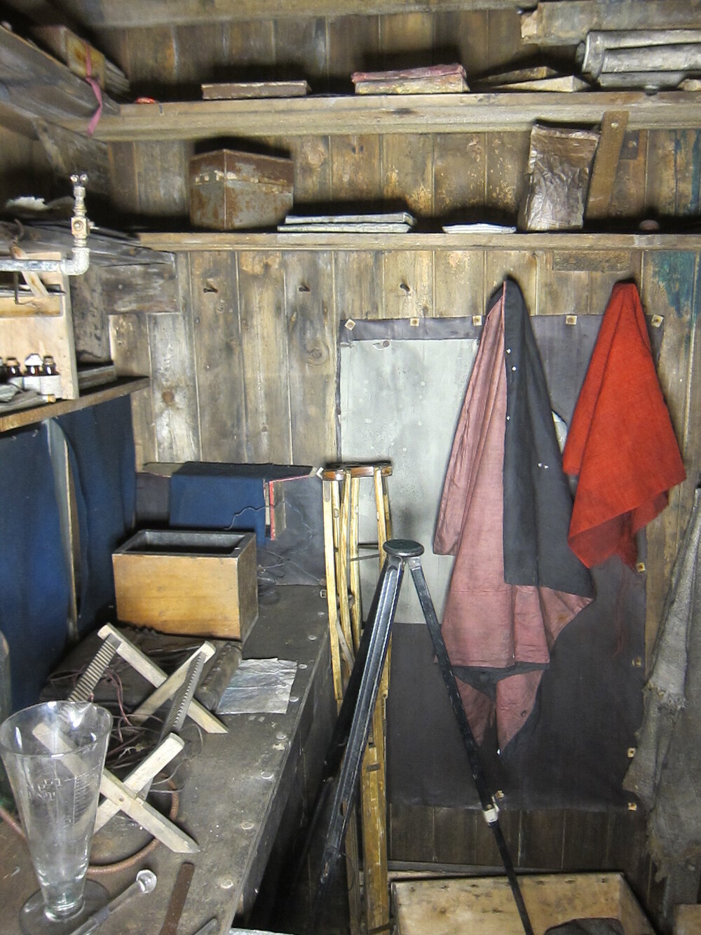 Artefacts on shelves and bench, Darkroom of Scott's 'Terra Nova' hut (003)