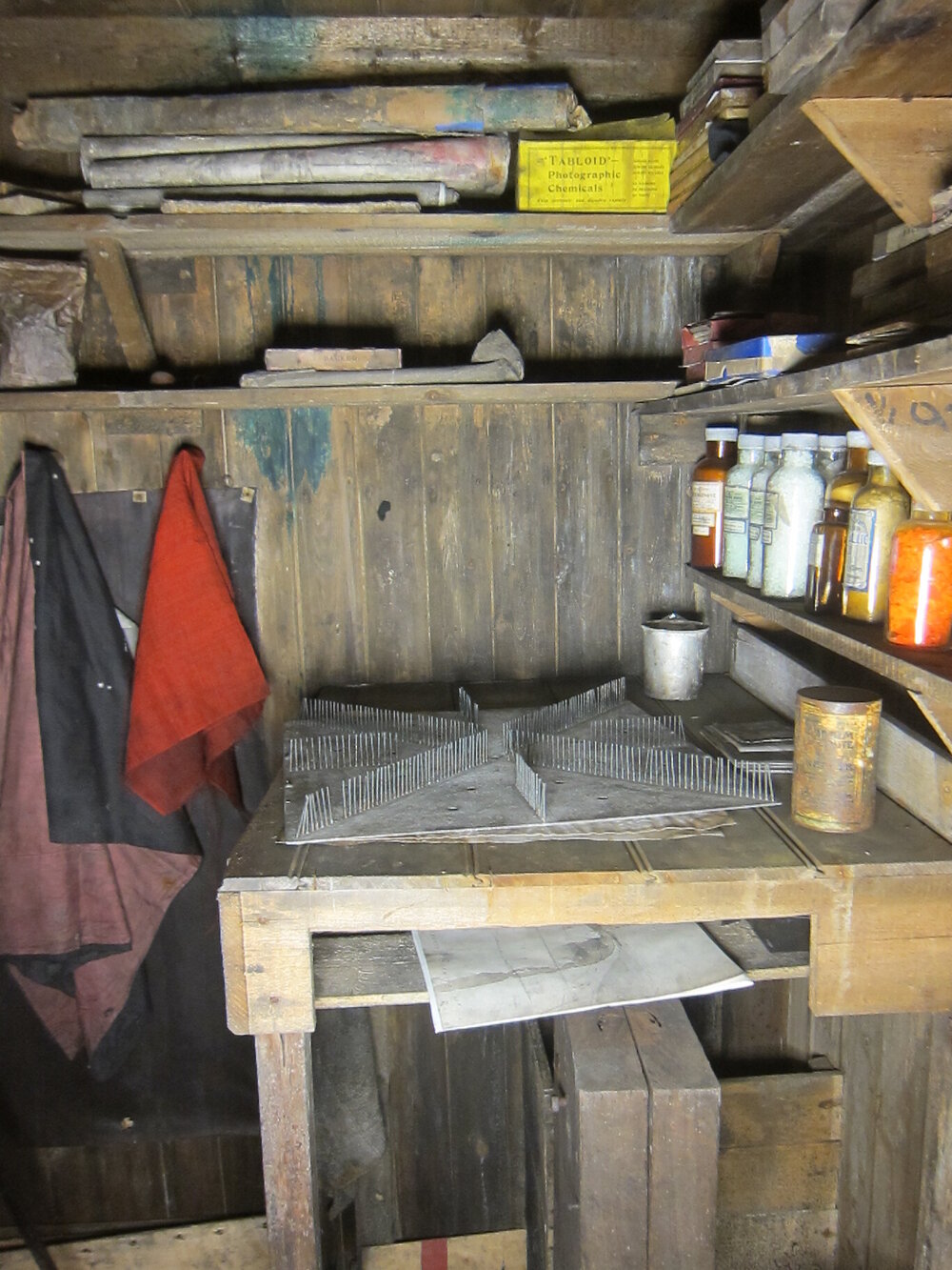 Artefacts on shelves and bench, Darkroom of Scott's 'Terra Nova' hut (004)