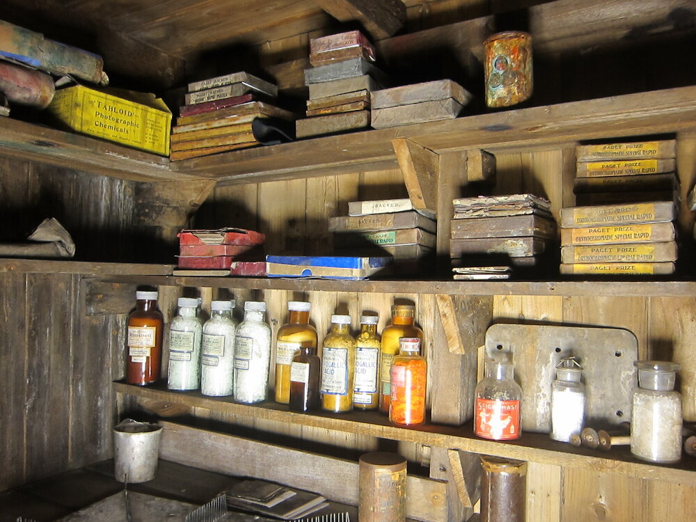 Photographic artefacts on shelves, Darkroom of Scott's 'Terra Nova' hut