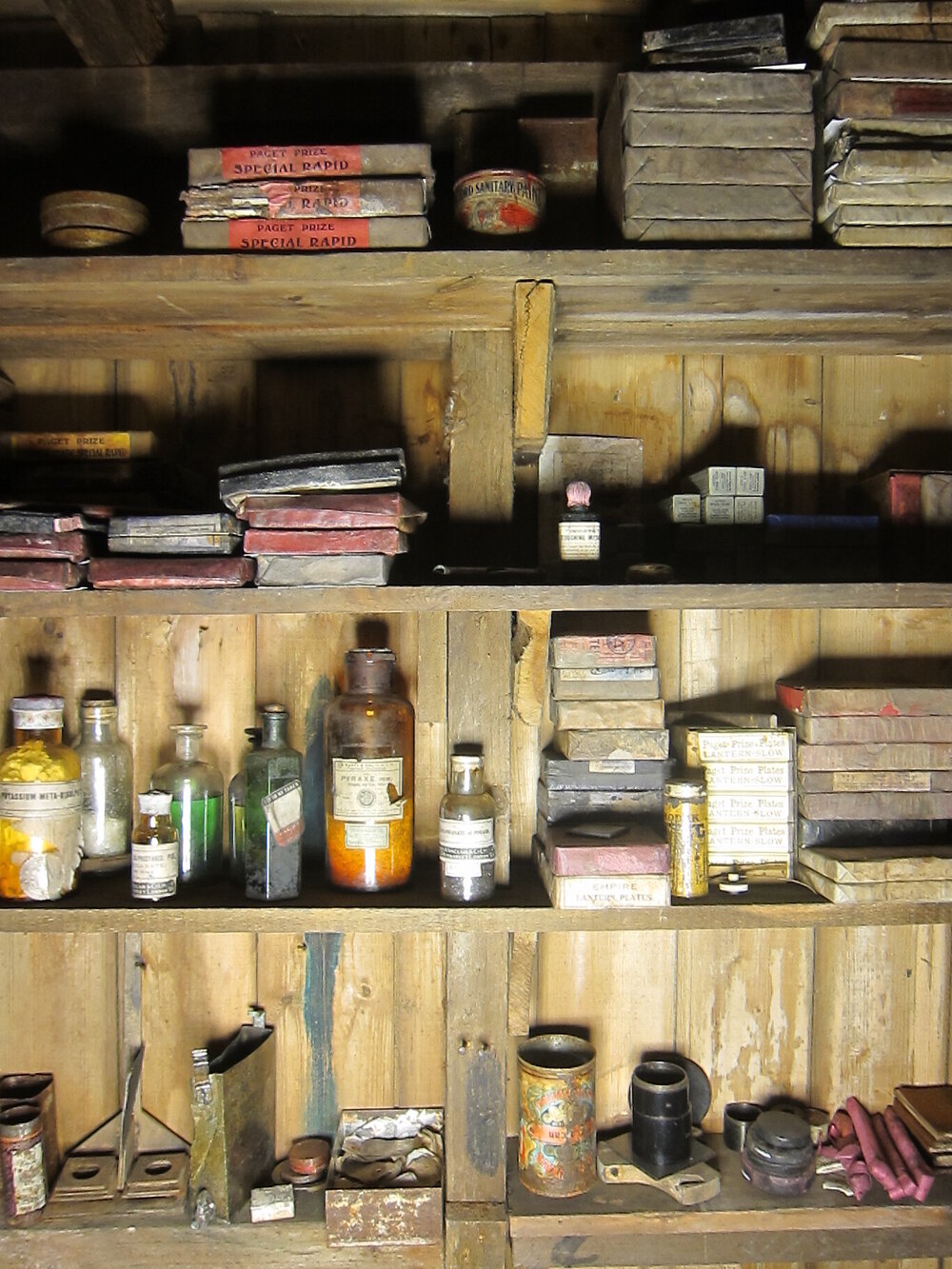 Photographic artefacts on shelves, Darkroom of Scott's 'Terra Nova' hut (002)