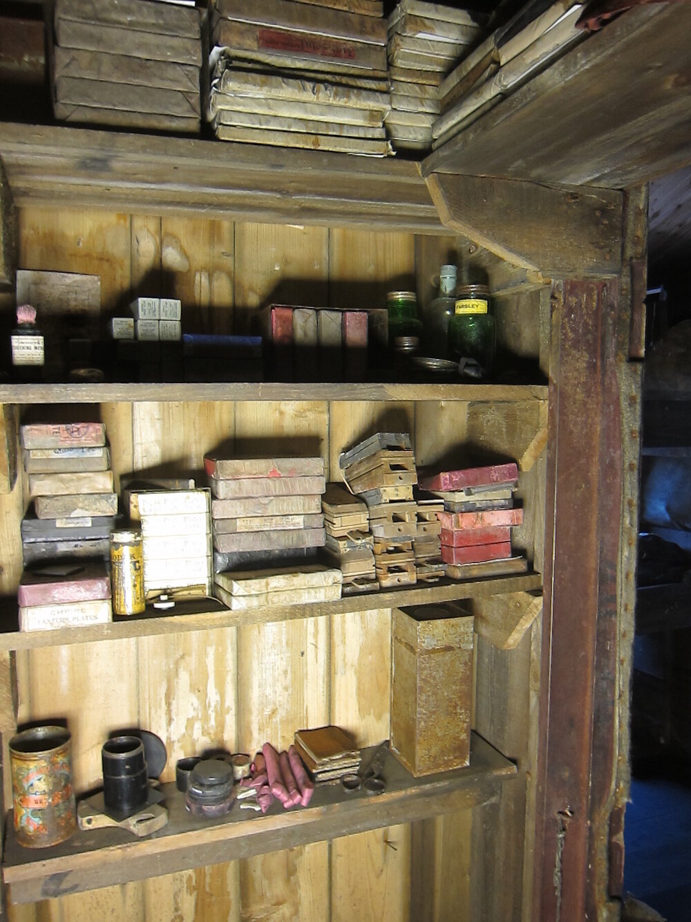 Photographic artefacts on shelves, Darkroom of Scott's 'Terra Nova' hut (003)