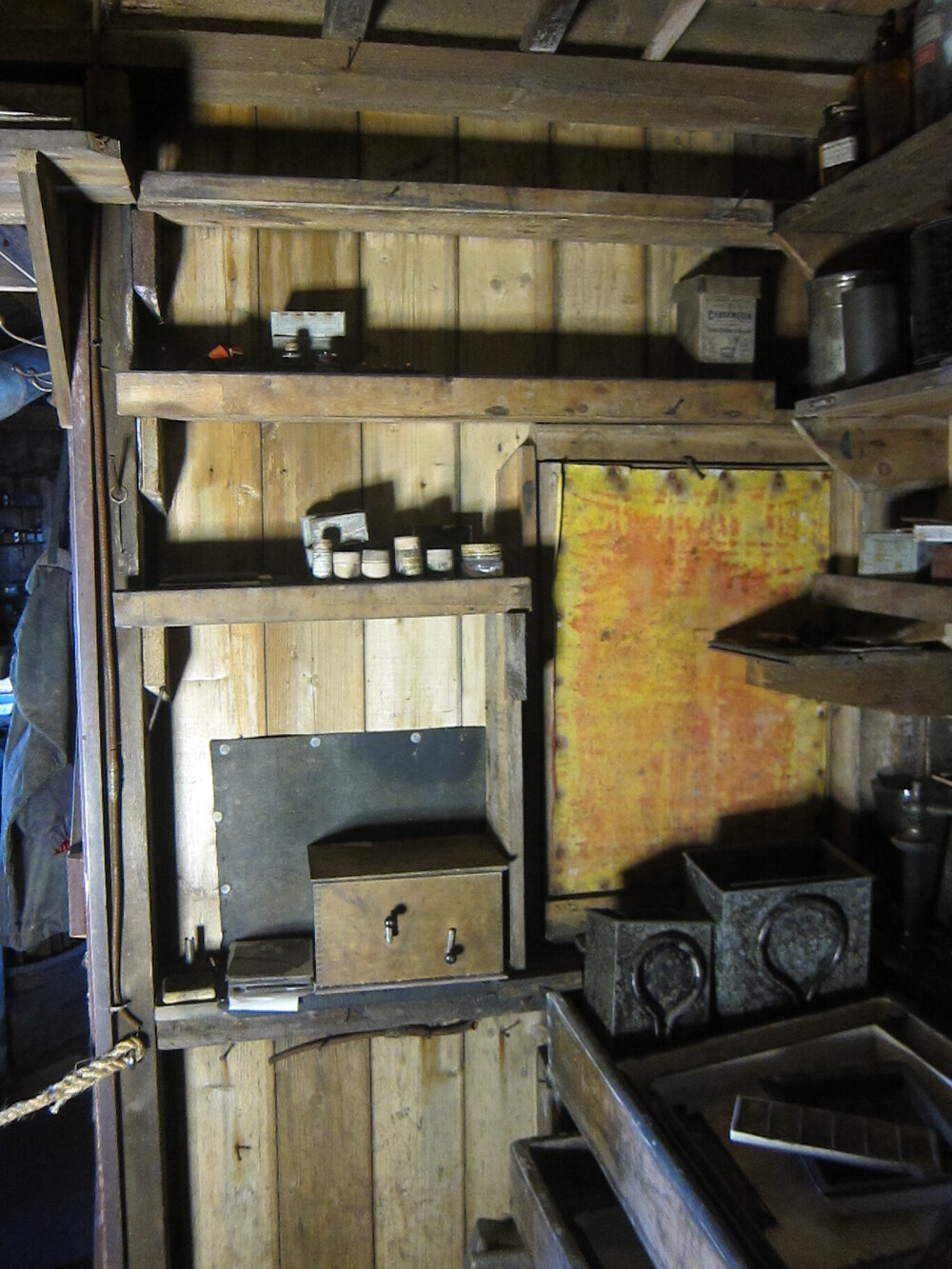 Artefacts on shelves and bench, Darkroom of Scott's 'Terra Nova' hut (005)