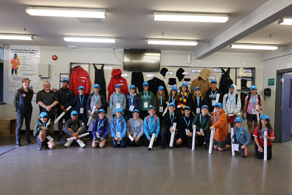 Group photo at the USAP warehouse at the Young Inspiring Explorers Summit